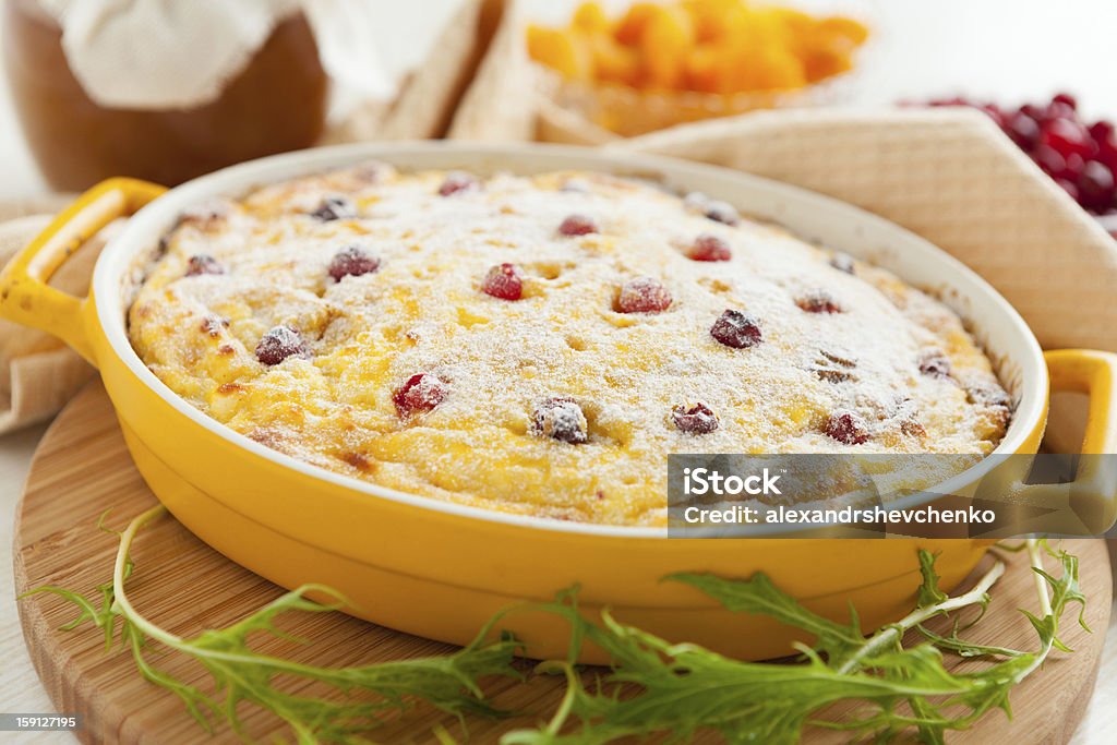 Cheese casserole with cranberries and raisins in dish Cheese casserole with cranberries and raisins in dish. Tasty dessert Baked Stock Photo