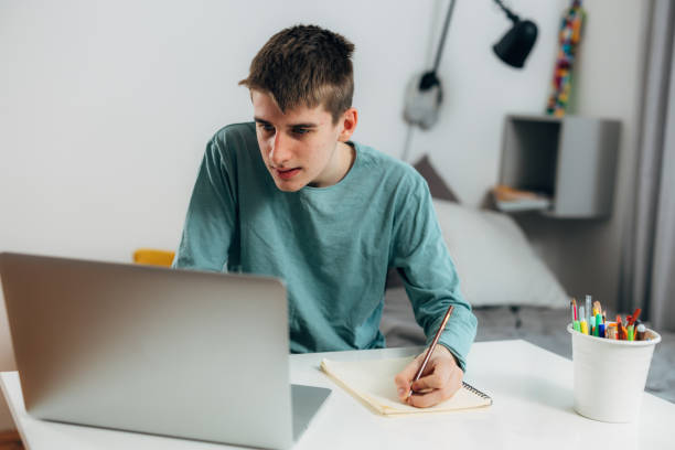 istock teenager boy at home 1591272527