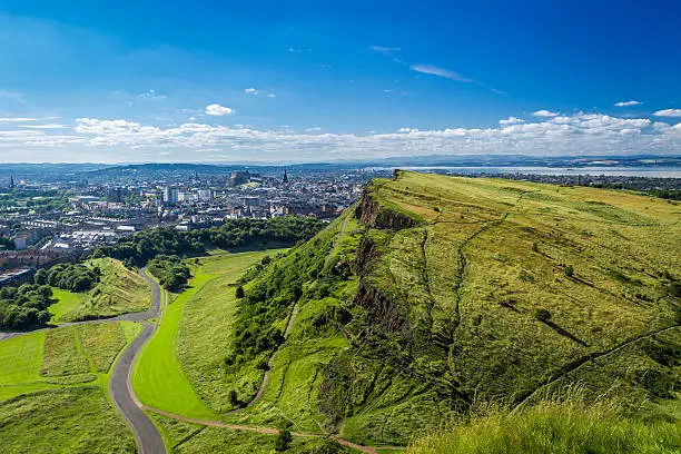 Photo of Edinburgh and green hills in summer