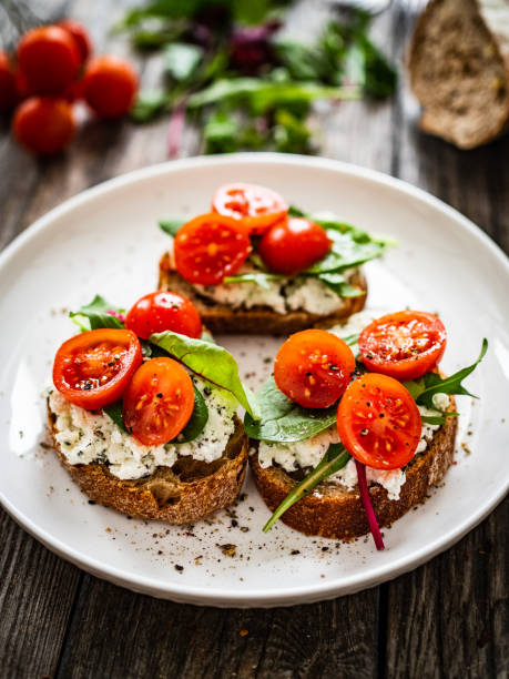 istock Breakfast - cottage cheese, bread and vegetables on wooden table 1591287902