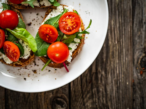 istock Breakfast - cottage cheese, bread and vegetables on wooden table 1591288503