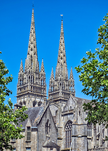 Bristol, UK - June 30th 2019: A view of the towers of the magnificent Bristol Cathedral alongside the beautiful building that houses the Bristol Cathedral Choir School, in the city of Bristol, UK.