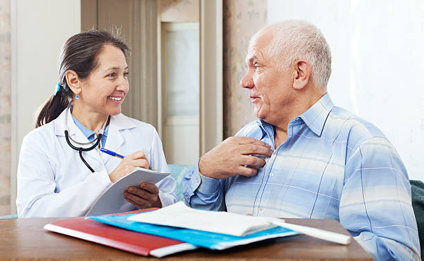 istock senior man  complaining to friendly doctor 159137878