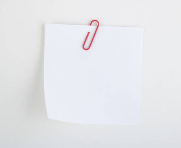 istock Paper clip holding a blank 1591383983