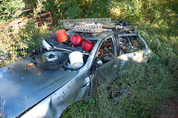 istock Abandoned rusty car full of garbage 1591385657