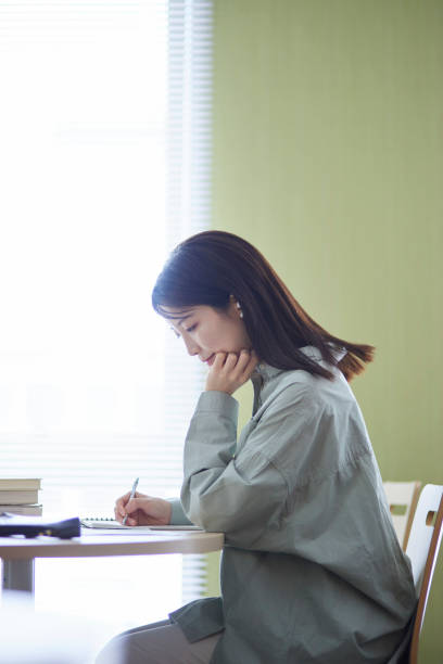 Japanese woman studying in the library