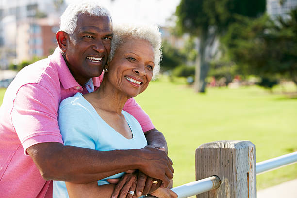 istock Senior Couple Walking In Park Together 159142449