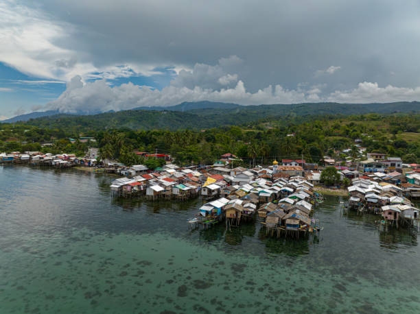 Fishermen village in Zamboanga. Philippines. Village of fishermen with wooden houses on the water, with fishing boats. Zamboanga. Philippines, Mindanao. zamboanga del sur stock pictures, royalty-free photos & images