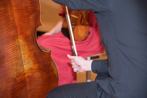 a cello or violoncello, string instrument played with a bow