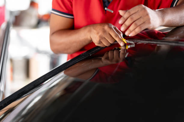 istock Car side window film removal and tinting installation 1591467256