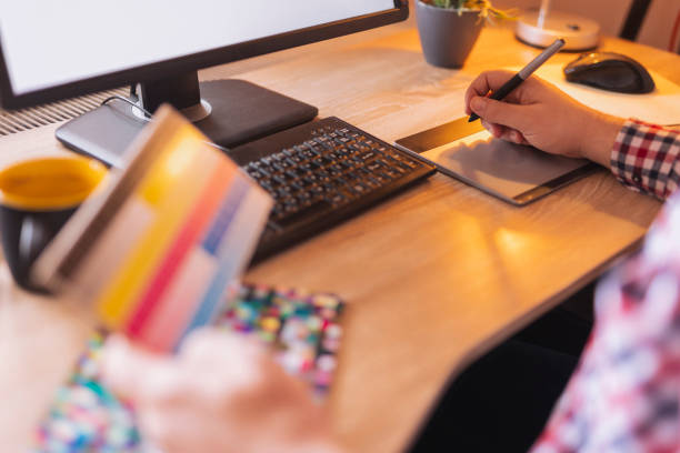 istock Designer choosing color from color pallete while working 1591489066