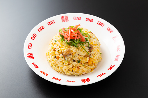 Delicious fried rice on a black background.