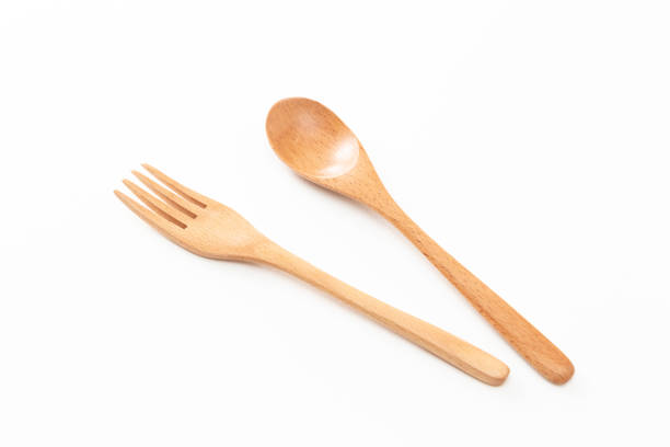 istock Wooden cutlery on white background. 1591512376