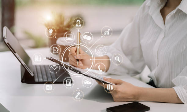 istock Businesswomen working with laptop and digital tablet computer in office with digital marketing media in virtual icon. 1591523089
