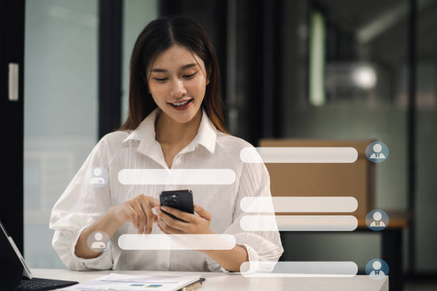 istock woman using mobile phone to chat with friends during free time. 1591523105