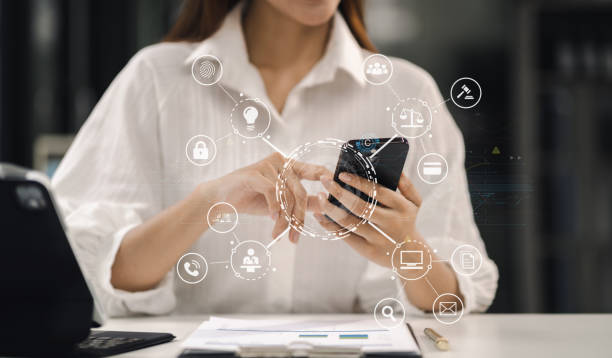 istock Copyright or patent concept, Person hand using laptop computer, tablet and smartphone with virtual screen copyright icon trademark, Creation ownership against piracy at office. 1591523133