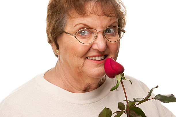 istock Attractive Senior Woman with Red Rose 159153626