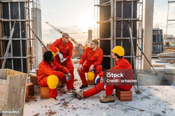 Construction Workers Taking A Break After Working On A Construction ...