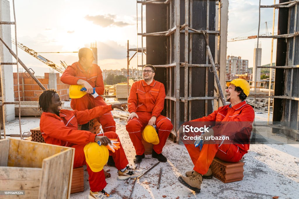 Construction Workers Taking A Break After Working On A Construction ...