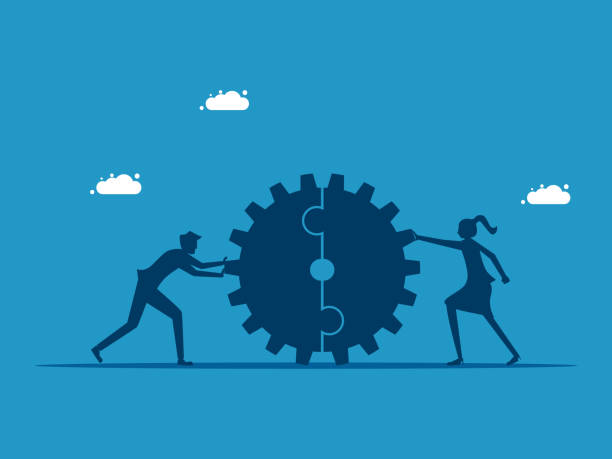 istock Working together perfectly. Two businessmen pushing a cogwheel together 1591569792