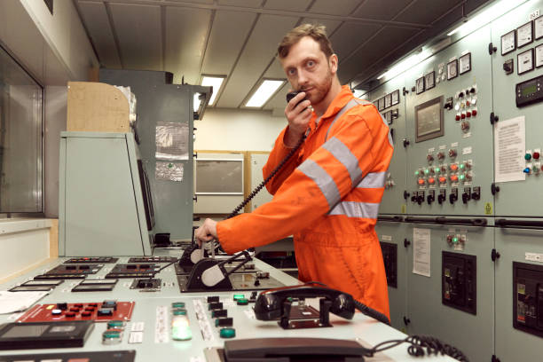istock Offshore engineer communicating by VHF radio with deck officer. 1591582413