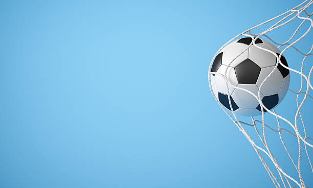 istock Soccer ball hitting the back of a net on a blue background 159161180