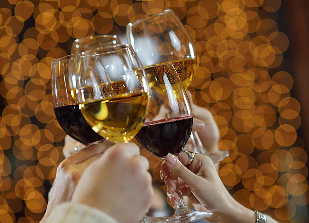 istock Five hands toasting five glasses of red and white wine 159161259