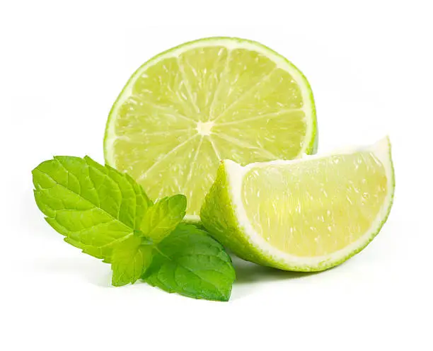Limes with mint on white background