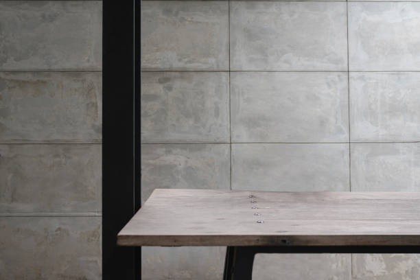 Background of modern concrete wall with wooden table