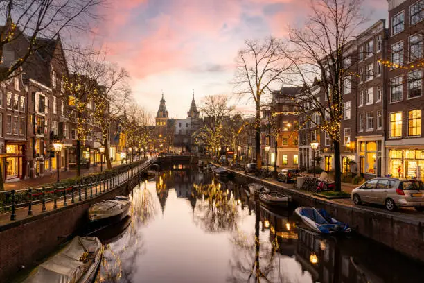 Christmas time at the Spiegelgracht in the old town of Amsterdam. On the horizon the towers the rijksmuseum.