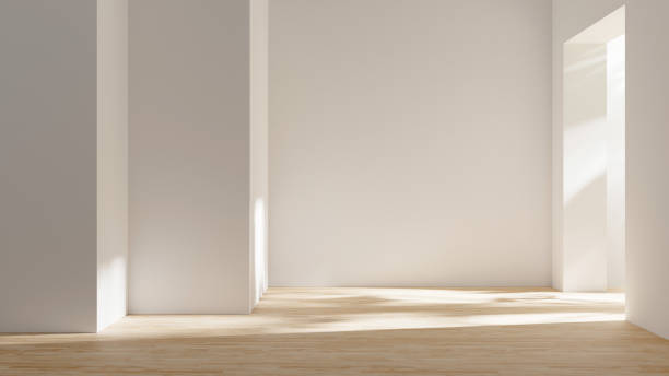 istock Abstract empty studio room with sunlight and leafs shadows, empty living room design interior with light beams and wooden floor 1591660868