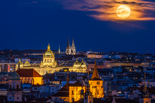 So called super full moon rising above the Prague cityscape