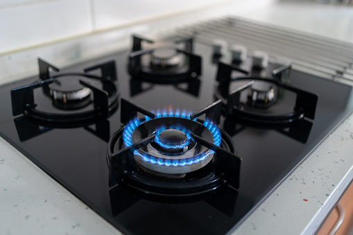 Blue Flames Of Gas Stove In Kitchen