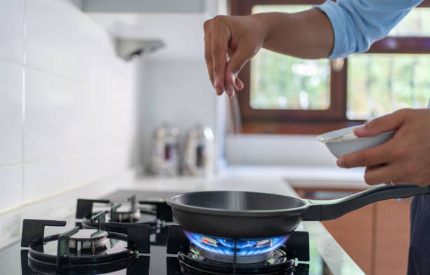 istock Man Putting Sugar In Frying Pan 1591673632