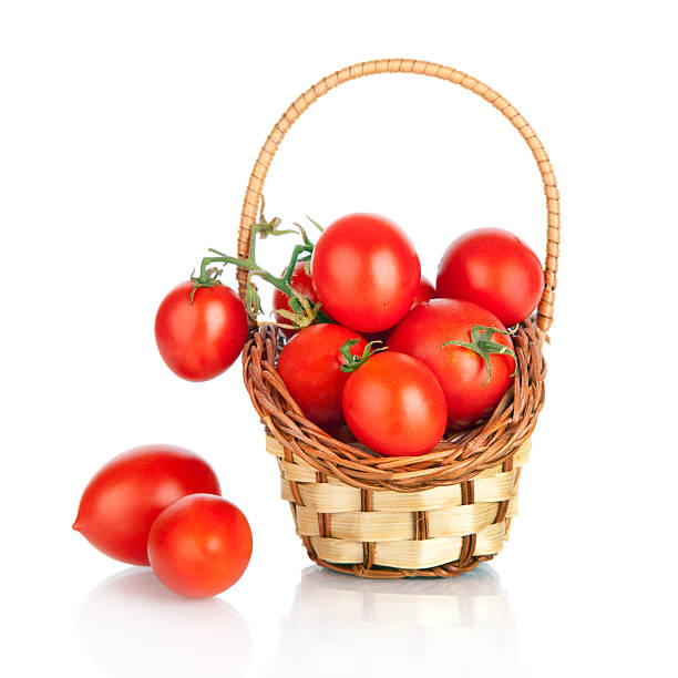 istock Cherry tomatoes in a basket, isolated on white 159168435