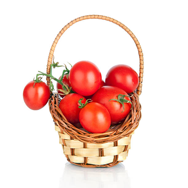 istock Cherry tomatoes in a basket, isolated on white 159168459