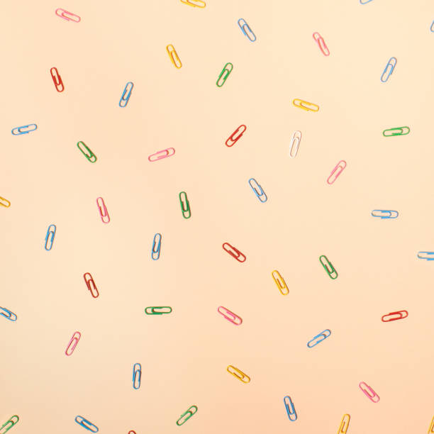 istock School concept patern of multicolor paper clips. Office time layout. flat lay. 1591695275