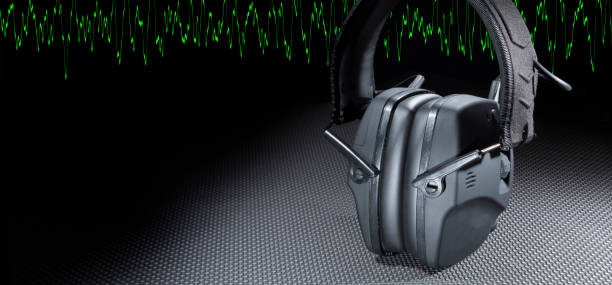 istock Green sine wave and protective headphones 1591698454