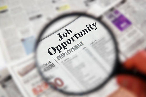 istock Magnifying glass focusing on classifieds section 159171378