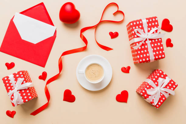istock Mug coffee and gift box on colored background. Flat lay composition. Holiday concept 1591716279