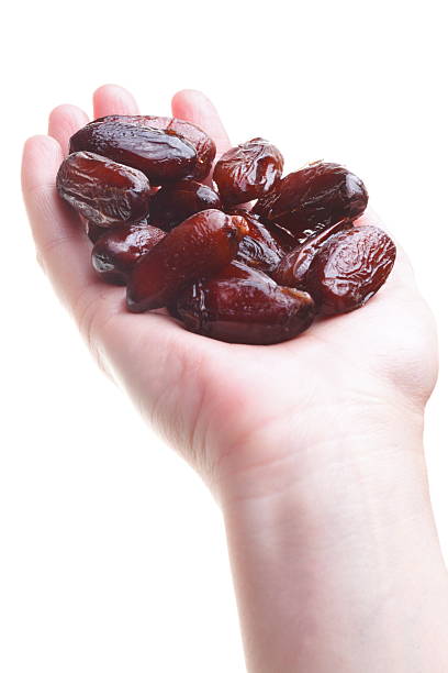 istock Dried date fruits in palm isolated 159171711
