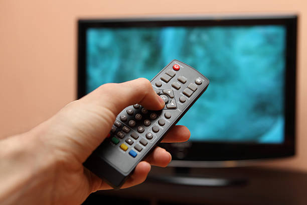 istock TV remote control with a television in the background 159175817