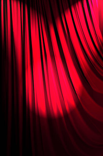 istock Brightly lit curtains in theatre concept 159176311