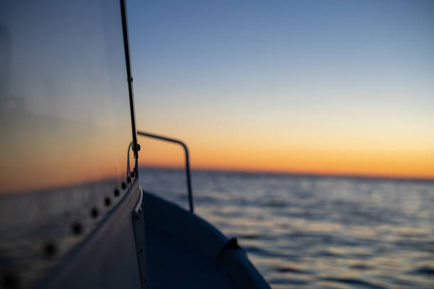 fishing boat going into the sunset
