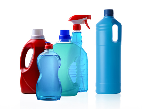 Assortment of cleaning products in plastic containers for house cleaning