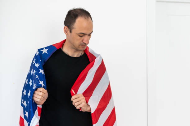 Man holding flag and posing for photoshoot