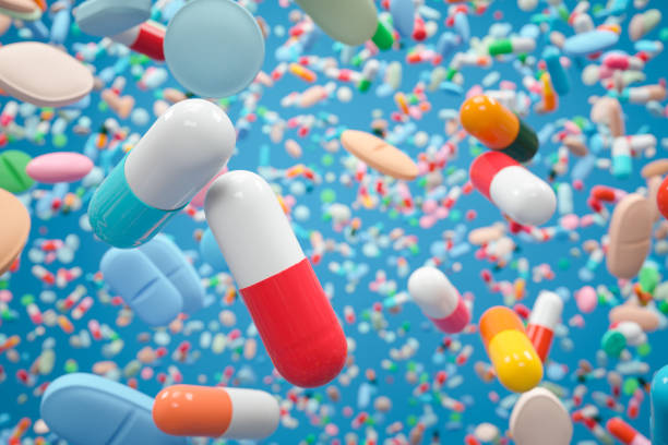istock Colorful Pills on Blue Background 1591783914