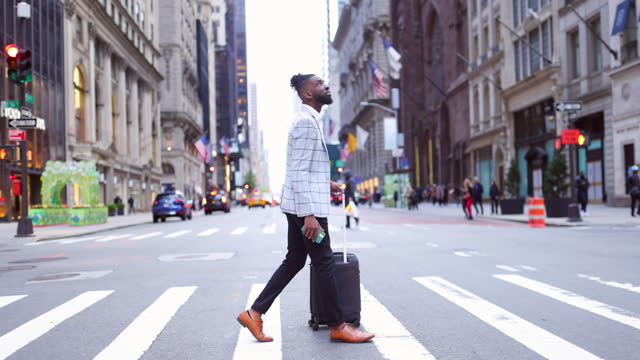 Affluent black businessman on a trip to NYC, zebra crossing