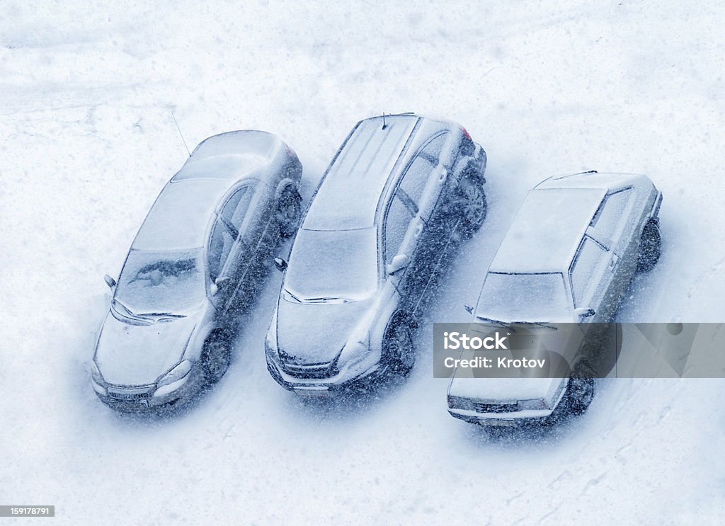 Cars covered with snow Top view of stopped cars in snow storm Coach Bus Stock Photo