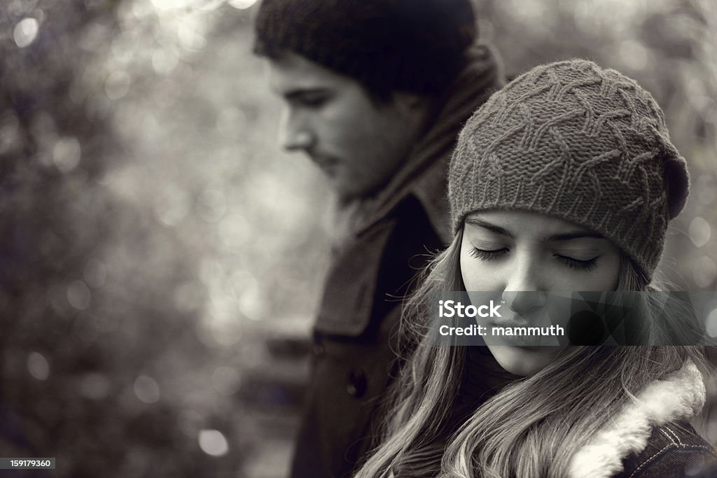 relationship difficulties Young couple having relationship difficulties, outdoor shot Sadness Stock Photo